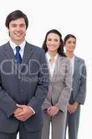 Smiling young businesspeople standing in line