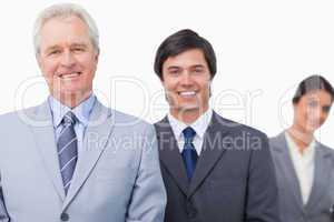 Smiling mature salesman with his employees