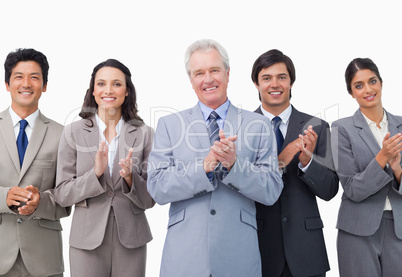 Senior businessman and his team applauding