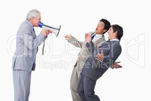 Senior salesman with megaphone yelling at his employees