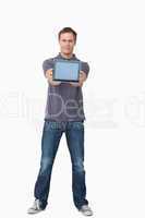 Young man showing screen of his tablet computer