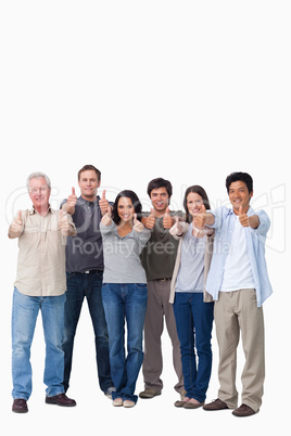 Smiling group giving thumbs up