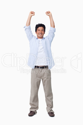 Cheering male with arms up