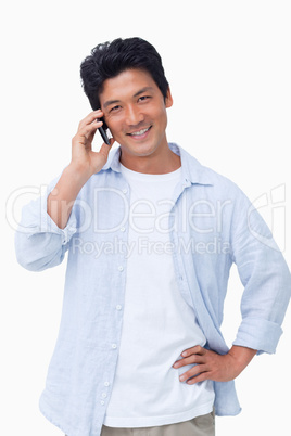 Smiling male on mobile phone