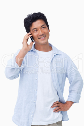 Smiling male on his mobile phone Smiling male on his mobile phone
