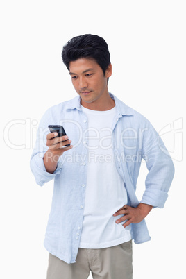 Male typing text message