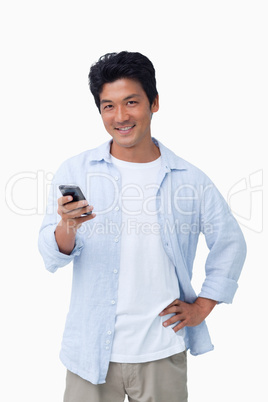 Smiling male with his cellphone