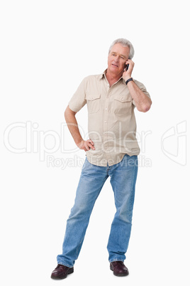 Mature man talking on his cellphone