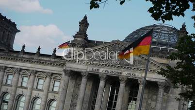 Reichstag - German Parliament in Berlin with waving flags