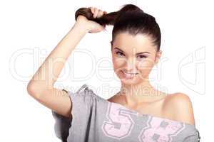 Young girl pulling her hair and smiling