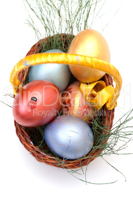 Colorful painted easter eggs in basket