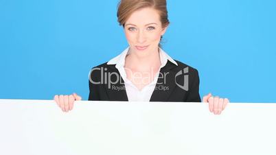 Smiling Professional Holding Blank Sign