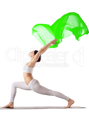 woman exercise yoga pose with green flying veil