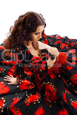 young woman sit in gypsy black and red costume