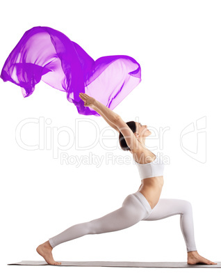 woman stand in yoga purple flying veil isolated