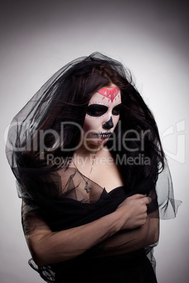 Young woman in day of the dead mask skull face art: Lizenzfreie Bilder