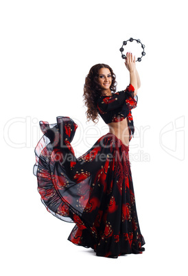 Young woman dance in gypsy with tambourine