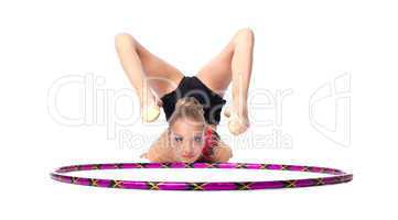 Young gymnast lay on white with hoop