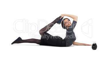 business woman lay in yoga pose with clock