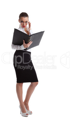 Sexy serious business woman look in book