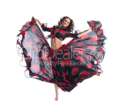 Beauty girl jump in gypsy dance isolated