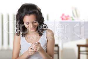 Young woman read sms on cell phone and smile