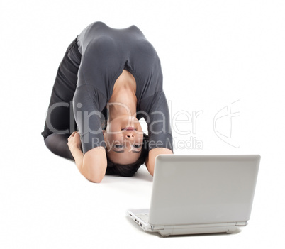 young business woman in yoga pose look at notebook