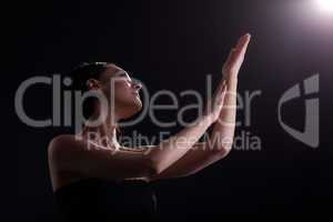 bare woman look at light with yoga sign