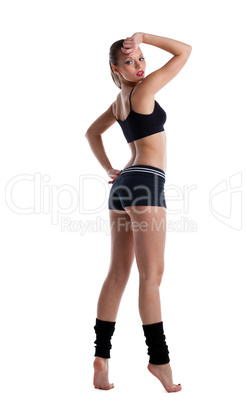 happy young woman posing in fitness costume