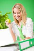 Green office woman smiling hold apple plant