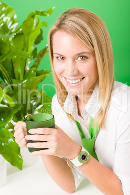 Green business office woman smiling plants