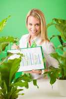 Green business office woman show charts plants