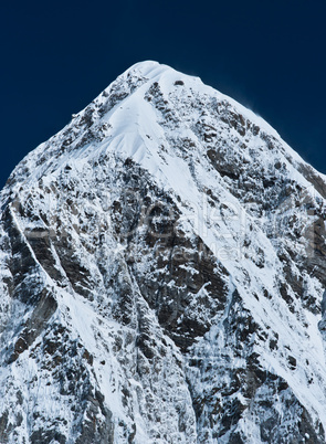 Himalayas: Pumori peak and blue sky