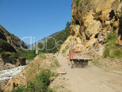 Truck driving on the unfinished new road from Nepal (Syabrubensi) to Tibet