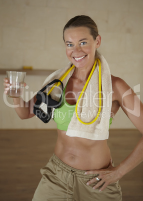 Woman is holding a glass of water