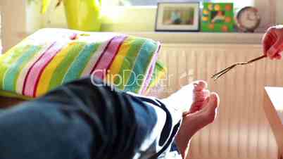 Man Tickling Barefoot Girl With a Straw