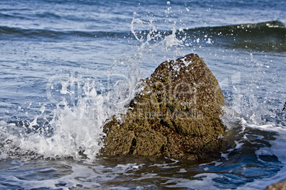 small rock in waves