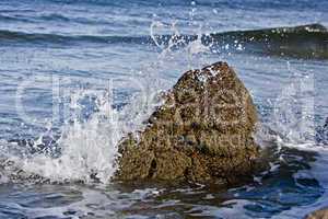 small rock in waves