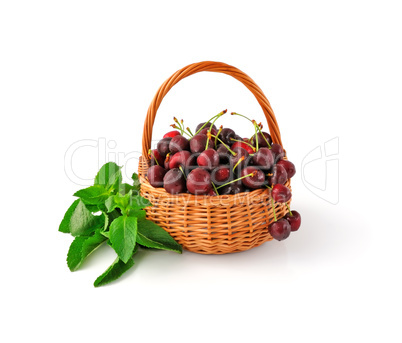 Basket with fresh cherries and mint