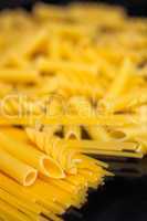 Italian pasta selection over black
