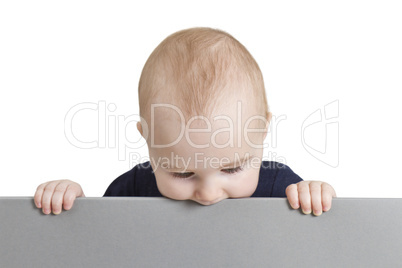 young child holding blank grey cardboard