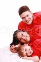 A family portrait of mom, dad and their daughter; isolated on th