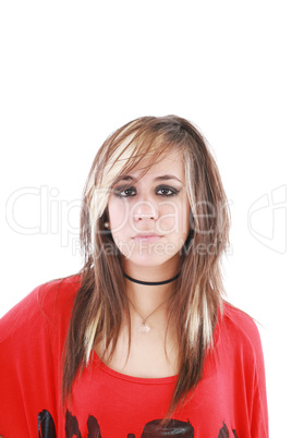 An attractive young female with a serious expression is wearing
