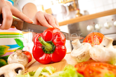 Woman's hands cutting vegetables