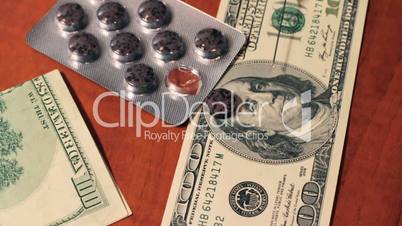 drugs and dollars on the table. slider shot.