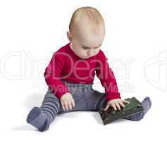 young child in white background with hard drive