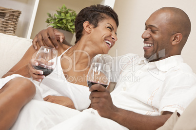 Happy African American Man & Woman Couple Drinking Wine