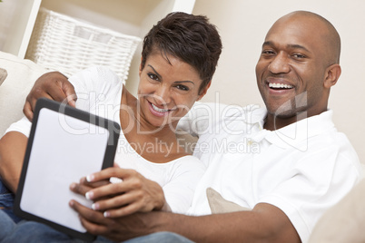 African American Man Woman Couple Using Tablet Computer