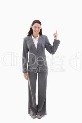 Businesswoman smiling and presenting a product on the top