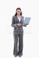 Businesswoman looking happy with a laptop
